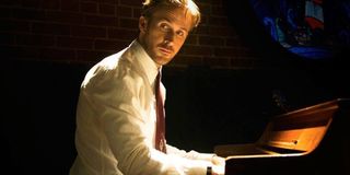 Ryan Gosling as Seb playing on his piano in La La Land.