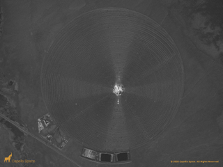 In this image, you can see the Crescent Dunes Solar Energy Project near Tonopah, Nevada. The 2-square-mile circular array of mirrors are captured by the SAR data, tilted toward a center molten salt tower and thermal storage energy tanks. On the outskirts you can see Highway 89 and elevation changes of the Tonopah Dunes Off-road Vehicle Park.