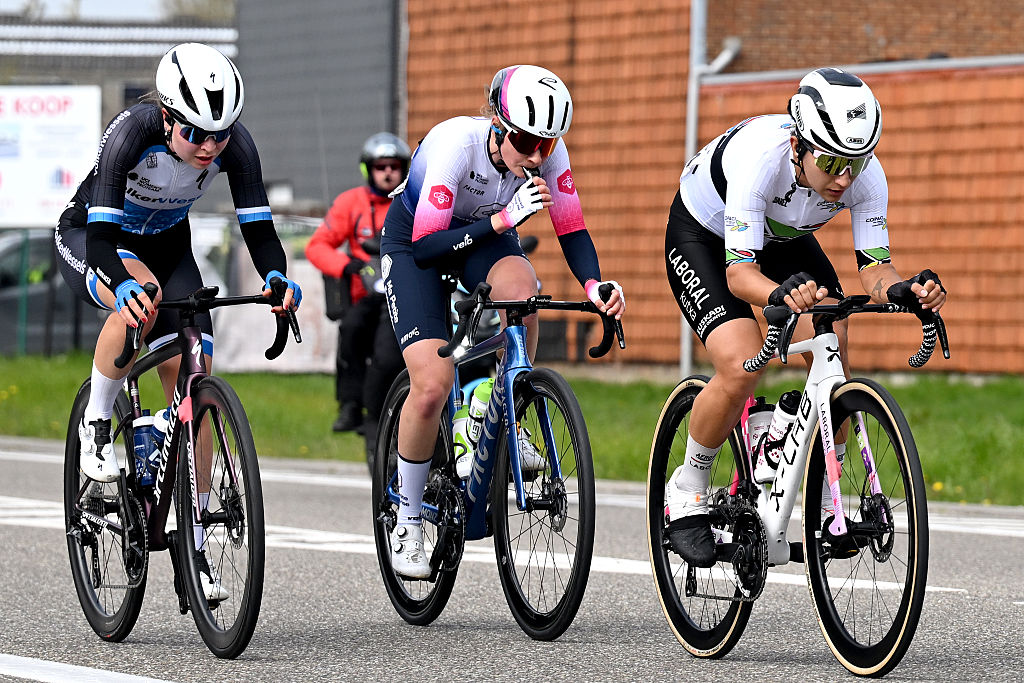 WAREGEM, BELGIUM - APRIL 01: (L-R) Bodine Vollering of Netherlands and Team VolkerWessels, Celia Le Mouel of France and Team Ma Petite Entreprise and Catalina Anais Soto of Chile and Team Laboral Kutxa - Fundacion Euskadi compete in the chase group during the 14th Dwars door Vlaanderen 2026 - Women's Elite a 128.8km one day race from Waregem to Waregem / #UCIWWT / on April 01, 2026 in Waregem, Belgium. (Photo by Luc Claessen/Getty Images)