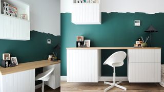 white desk with wood desktop in front of blue walls
