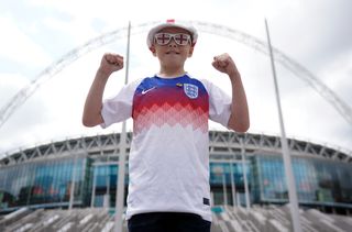 A young England fan outside the ground