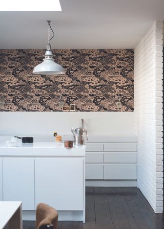 kitchen updates with a wallpaper feature wall in a white kitchen