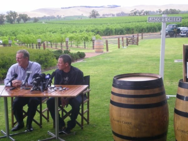 A press conference held near a barrel.
