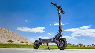 AUSOM DT2 Pro standing against a blue sky backdrop