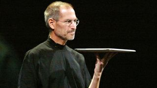 Steve Jobs holds up the original MacBook Air at 2008 Macworld Expo