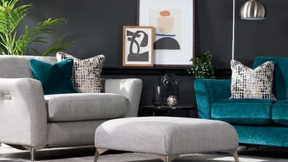 Green chenille sofa in a black living room