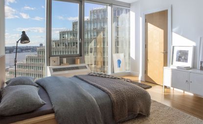 Bedroom with floor to ceiling window