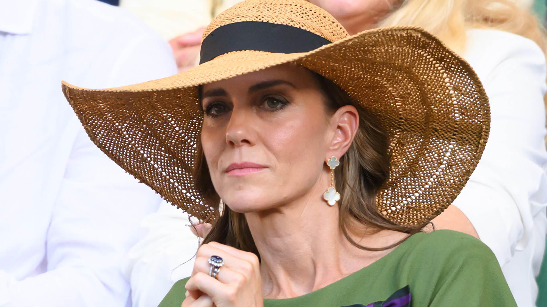 Kate Middleton wears a giant straw hat and a green dress to attend Wimbledon in July 2026