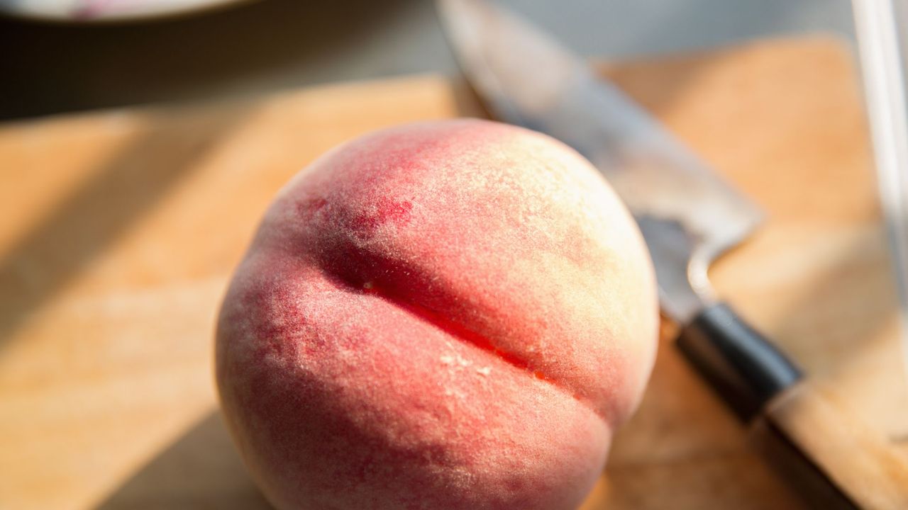 Brazilian Butt Lift: Peach on a chopping board