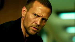 Harry Hole stares at something offscreen