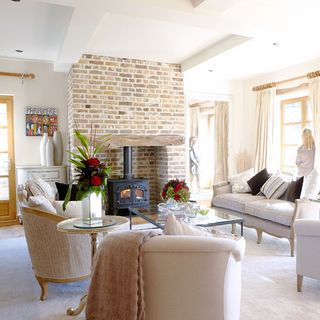 living room with brick wall and fire wall