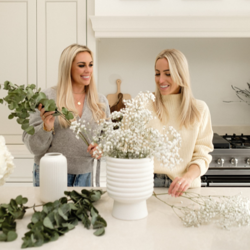 Style Sisters arranging flowers in kitchen
