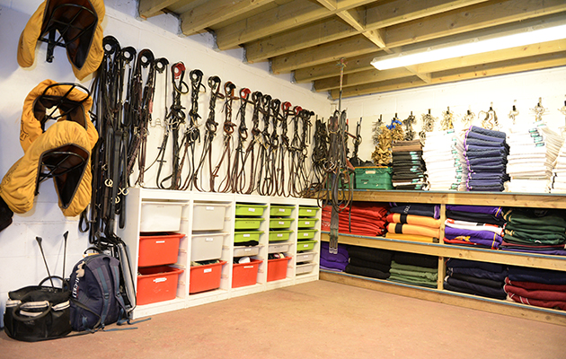 The immaculate tack room, where everything is colour-coordinated and labelled