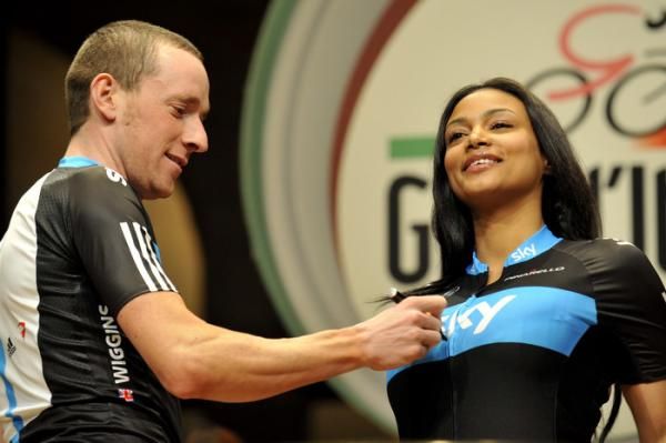 The Team Sky jersey model held her composure while Bradley Wiggins signed her top.