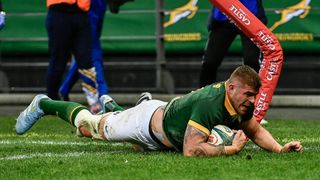 Malcolm Marx of the Springboks dives over the line for a try.