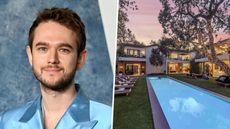 photo of zedds in a blue suit next to his house for sale