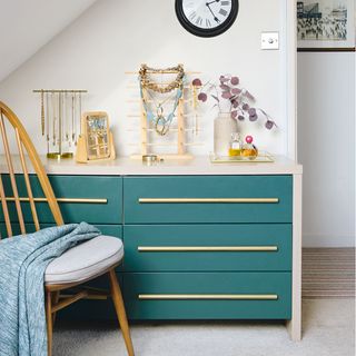 bedroom with green chest of drawers