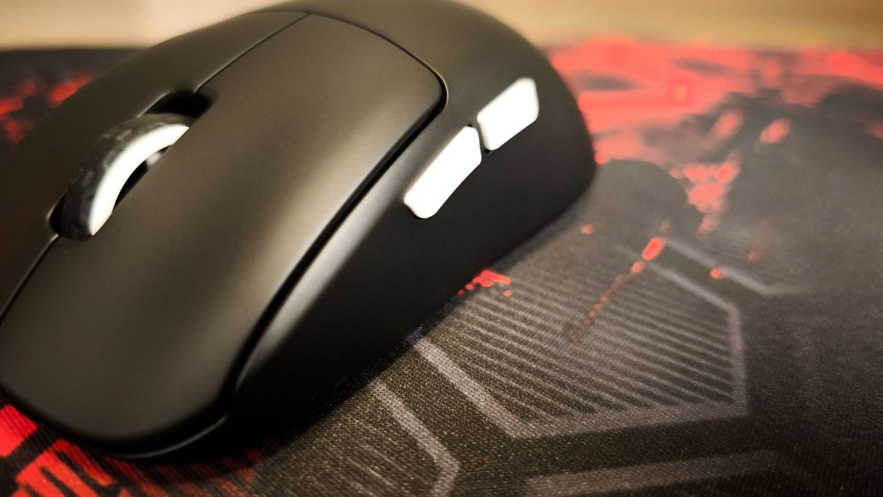 close-up of side of cherry mouse with white buttons