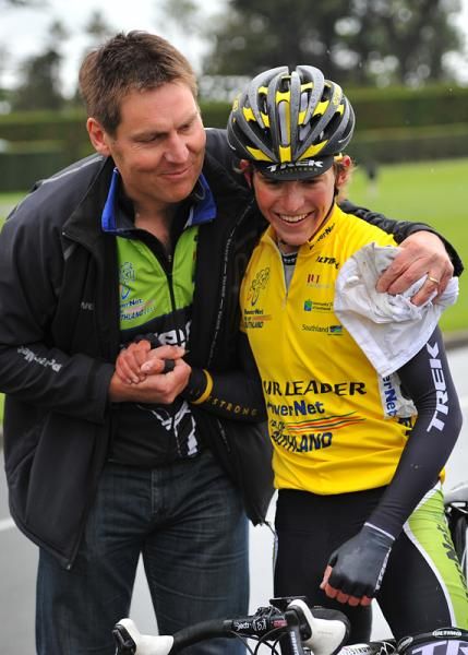 Josh Atkins receives a hug from the team manager
