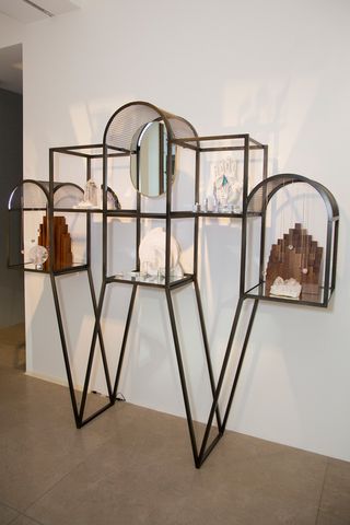 Metal geographically shaped display shelves