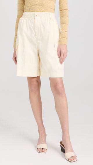 a model wears knee-length off-white shorts