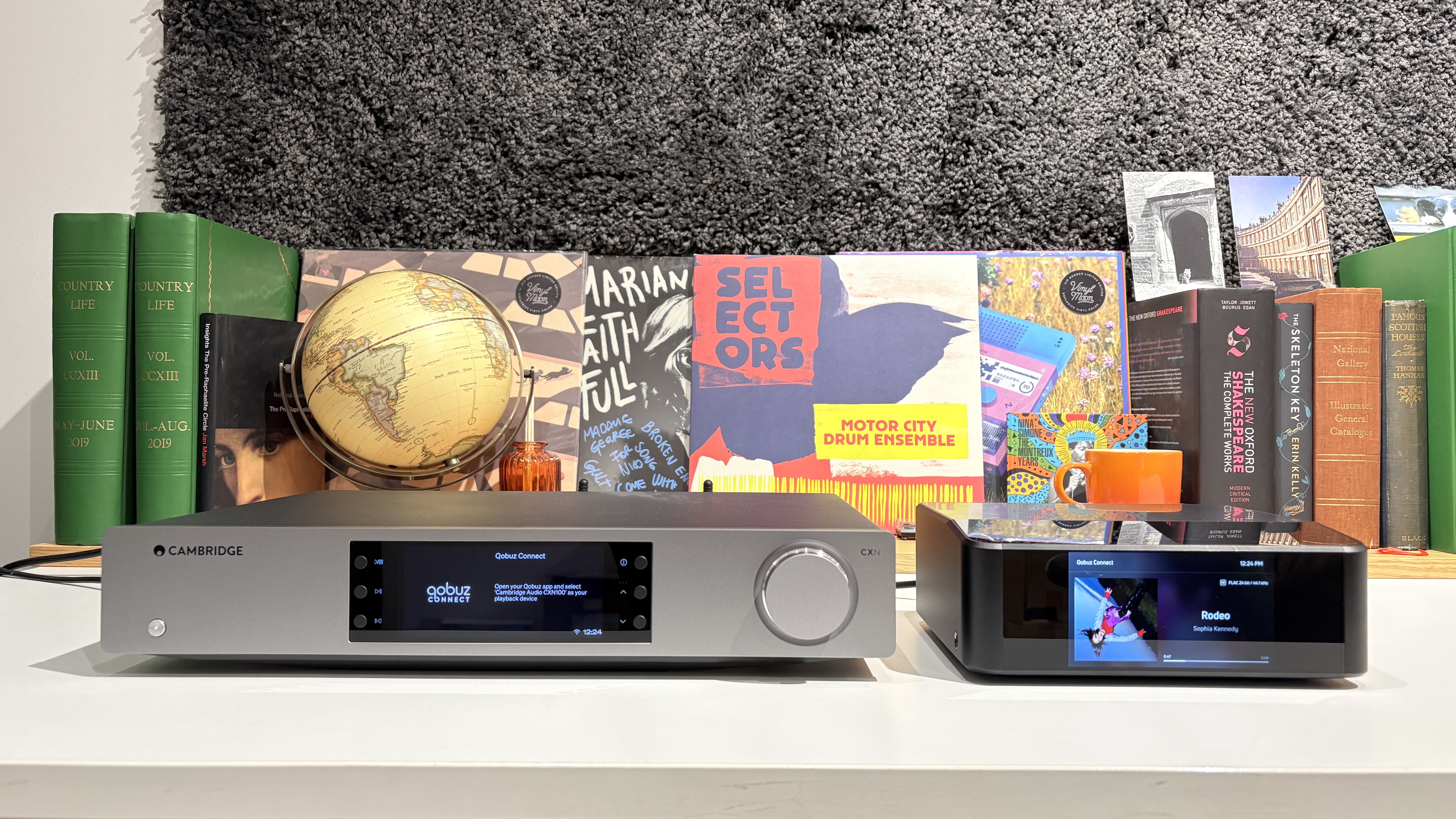 Bluesound Node Icon and Cambridge Audio CXN100 streamers placed next to each other on a white desk