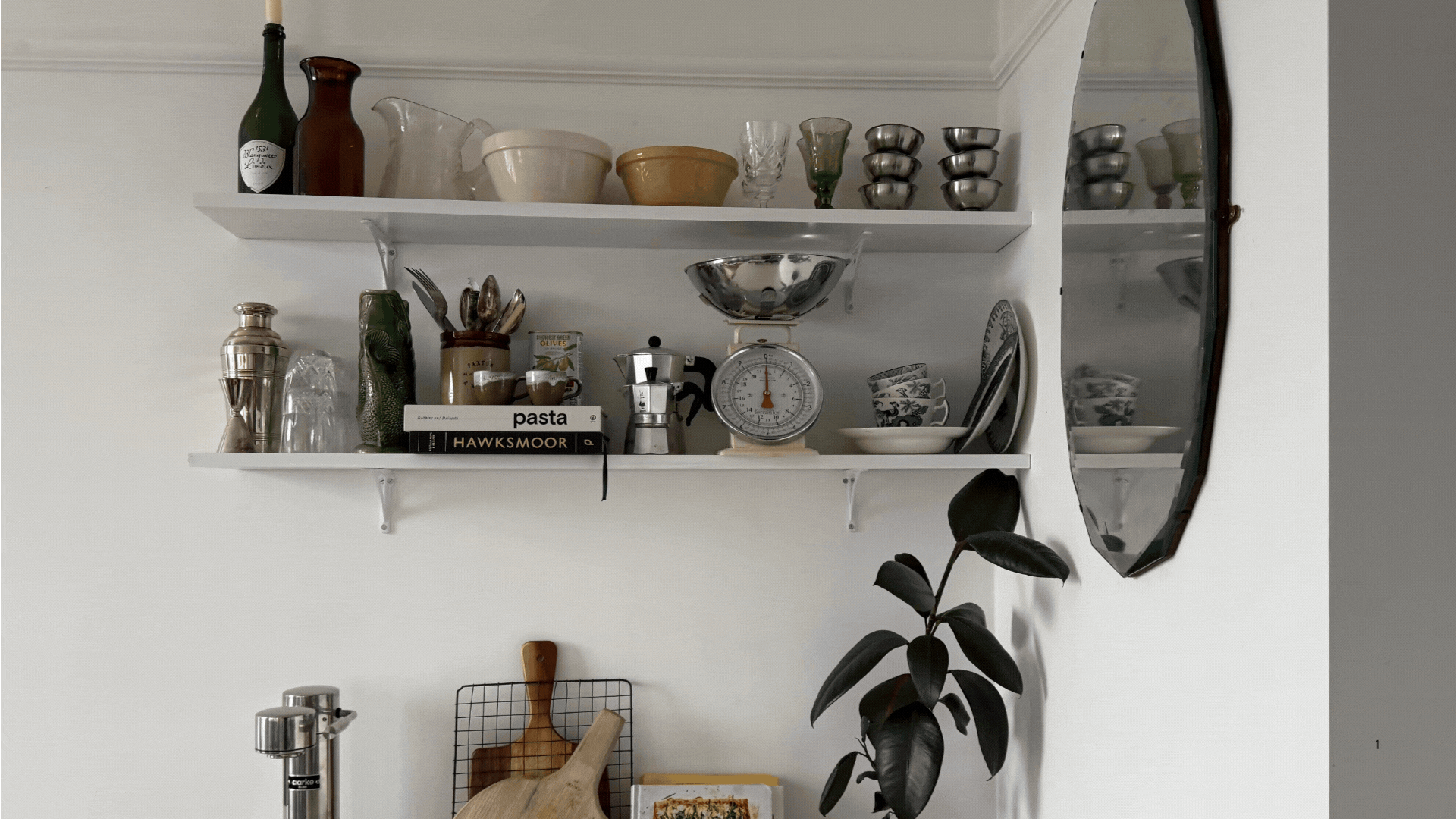 Rotating GIF of three different moments in a home (kitchen shelving, a vanity area, and a bedside table) that are decorated with a blend of antique decor pieces.