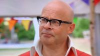 Harry Hill wears glasses and talks on Great British Bake Off.