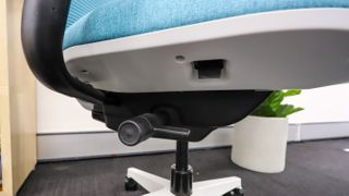 The adjustment lever and switch under the seat of of theSteelcase Personality Plus office chair