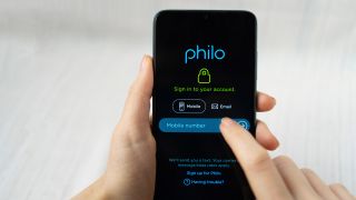 Philo application on a smartphone in female hand. 