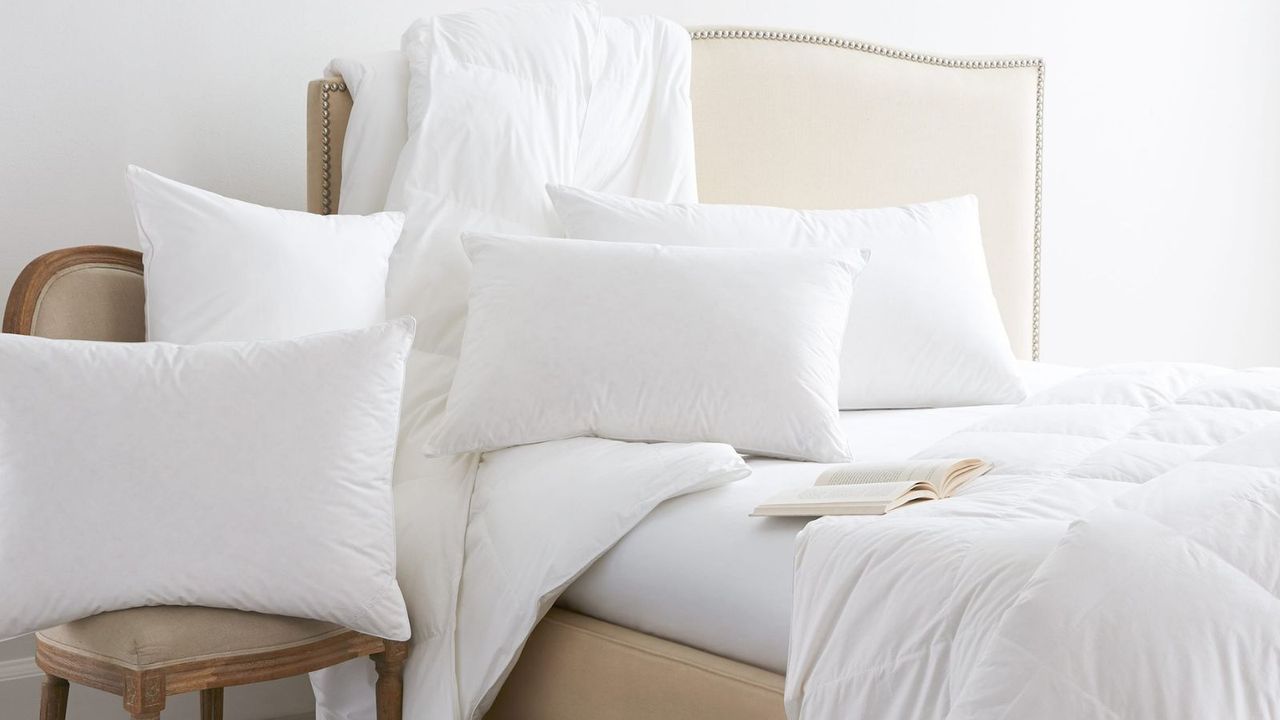 Some of the best pillows from Boll &amp; Branch on a bed.