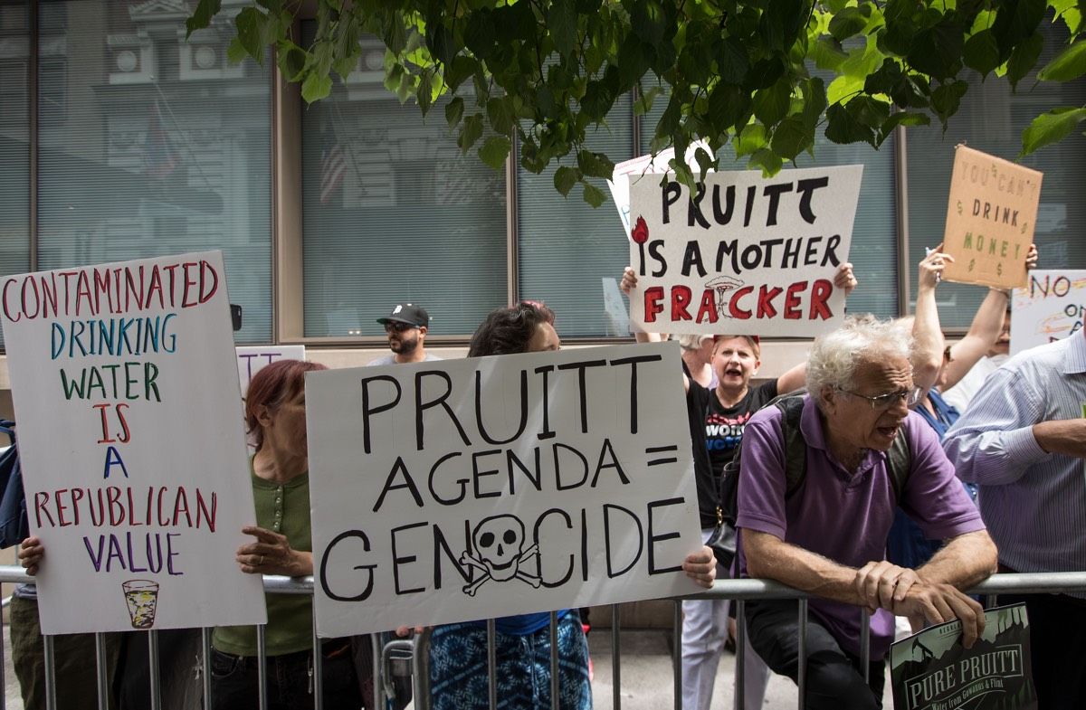 People protest outside the Harvard Club where EPA Administrator Scott Pruitt was scheduled to speak, June 20, 2017 in New York City. Pruitt cancelled his appearance, where he was supposed to discuss the environmental role of the United States following th