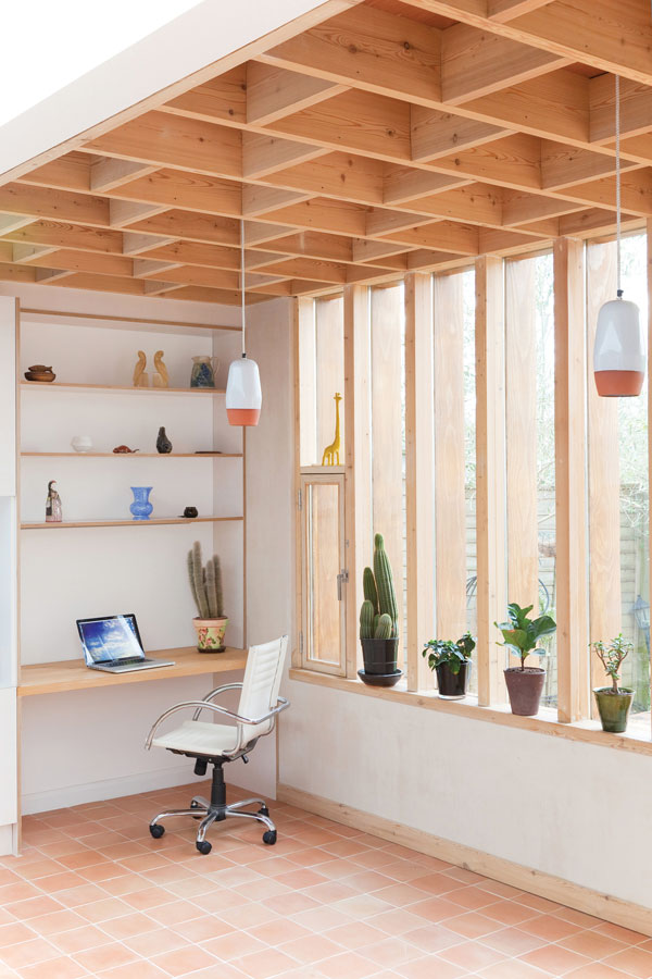 Contemporary living space with home office and exposed ceiling design