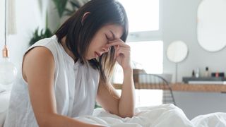 What causes sleepwalking? Image shows woman looking sleepy