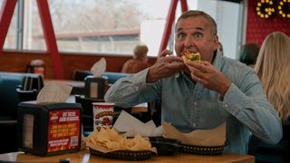 Phil Rosenthal eating a taco in Somebody Feed Phil season 6