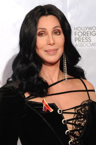 Singer Cher poses with black, wavy hair in the press room at the 67th Annual Golden Globe Awards held at The Beverly Hilton Hotel on January 17, 2010 in Beverly Hills, California.