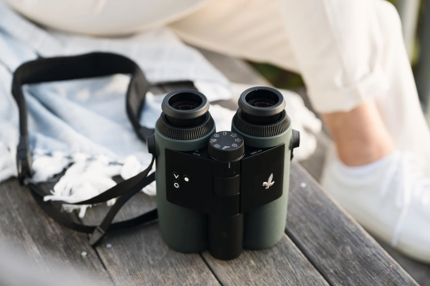 A pair of Swarovski binoculars on a table