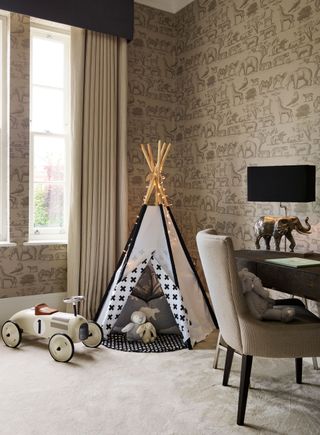 kids playroom with teepee, vintage car, desk, chair, zoo wallpaper, table lamp