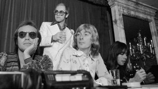 Songwriter Bernie Taupin, Musician/Singer/Songwriter Elton John, Musician/Singer Dee Murray and Musician Nigel Olsson during press conference to announce the upcoming Elton John American tour at The Beverly Wilshire Hotel, Beverly Hills, CA 1974.