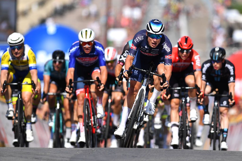 KNOKKEHEIST BELGIUM JUNE 16 Jasper Philipsen of Belgium and Team AlpecinFenix sprints to win ahead of Danny Van Poppel of Netherlands and Team Bora Hansgrohe Mads Pedersen of Denmark and Team Trek Segafredo blue leader jersey and Arnaud De Lie of Belgium and Team Lotto Soudal during the 91st Baloise Belgium Tour 2022 Stage 2 a 1756km stage from Beveren to KnokkeHeist BaloiseBelgiumTour on June 16 2022 in KnokkeHeist Belgium Photo by Luc ClaessenGetty Images