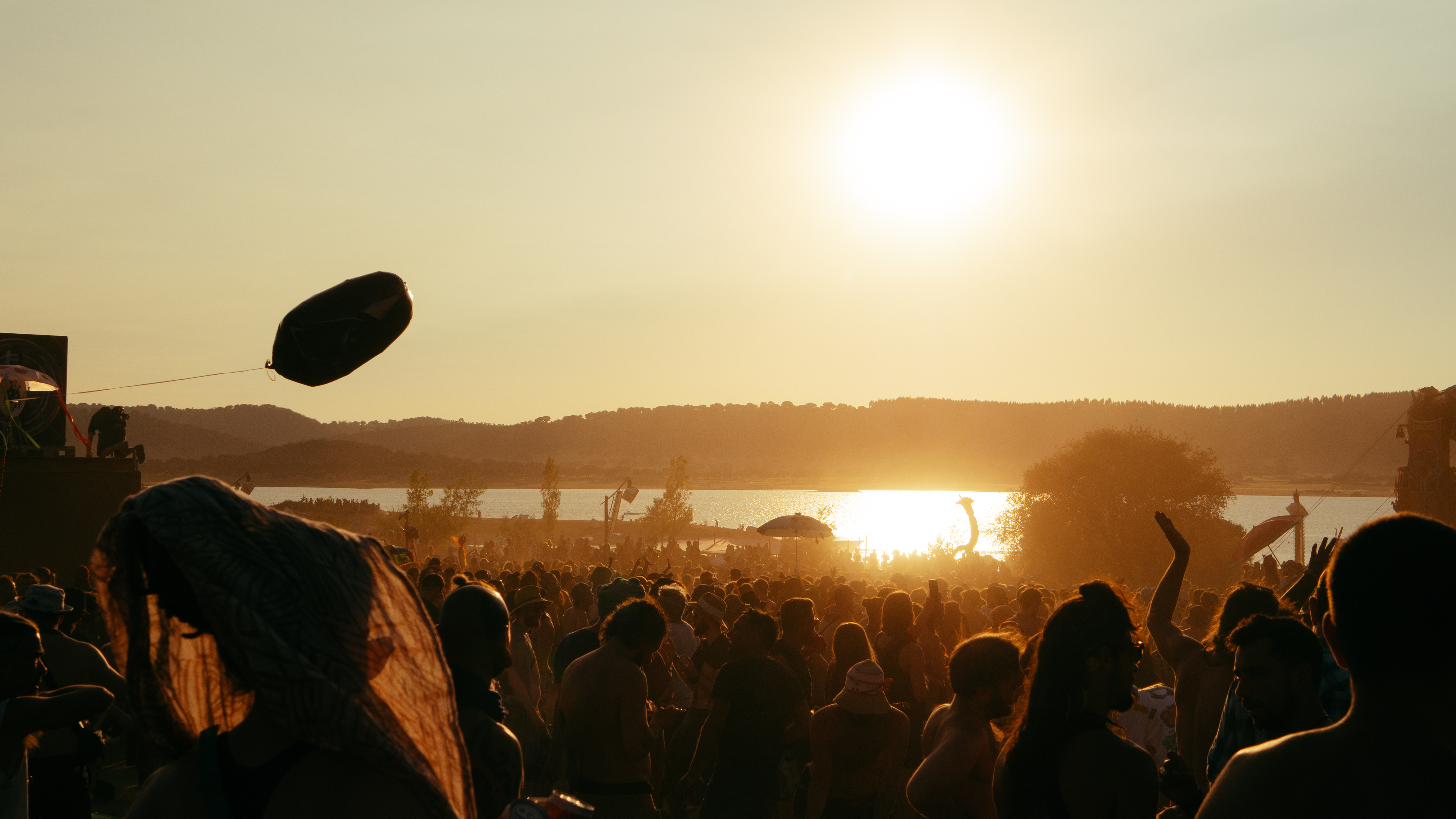 An image of a festival at Sunset with a lake in the background, Olympus EM-5 Mark II sample images