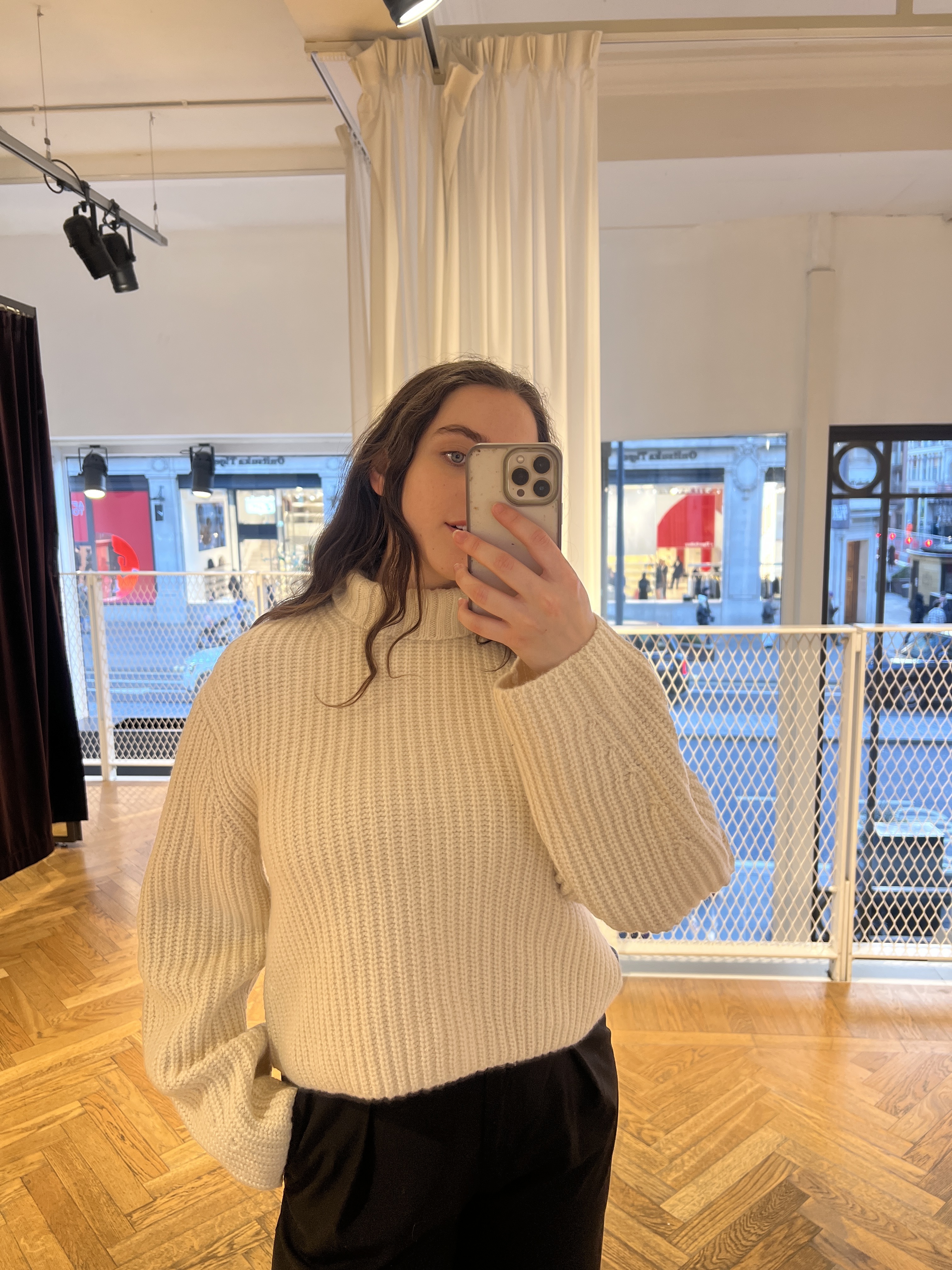 A collage ofBest Knockoff Luxury Clothing
&#039;s Ava Gilchrist wearing a wool jumper from &amp;amp; Other Stories.