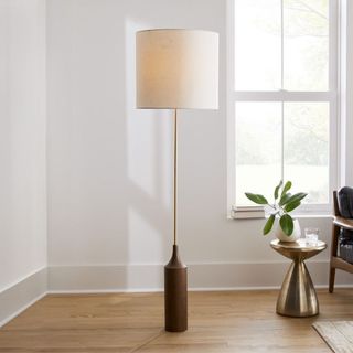 A floor lamp in a neutral living room