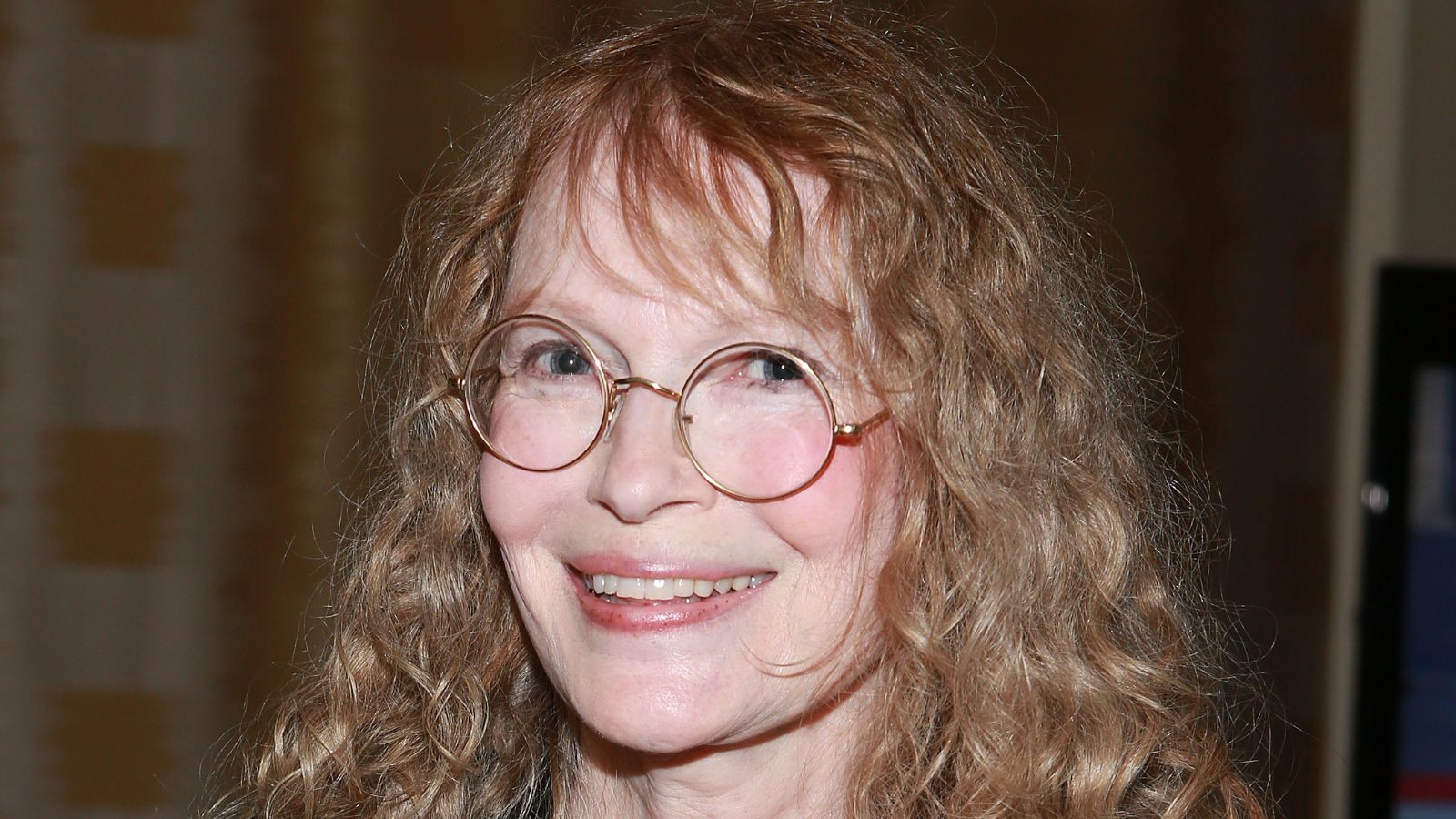 mia farrow on a neutral background