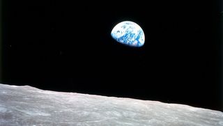 Earth rising above the surface of the moon, as seen from Apollo 8 in December 1968.