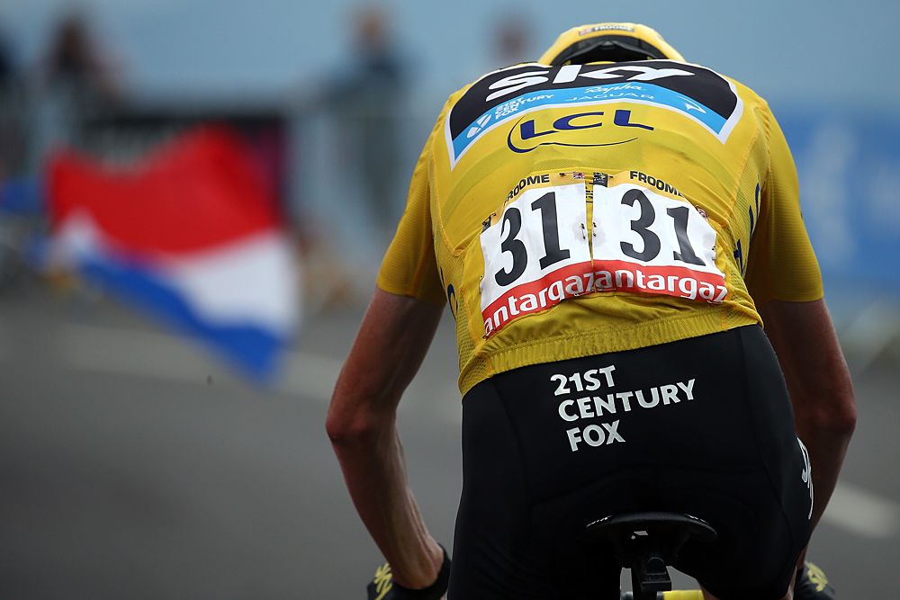 Chris Froome racing to the French flag