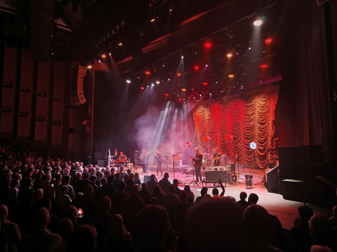 A photo of The Divine Comedy playing live.
