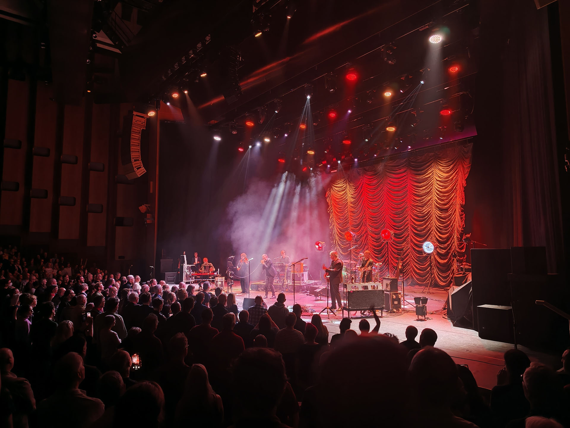A photo of The Divine Comedy playing live.