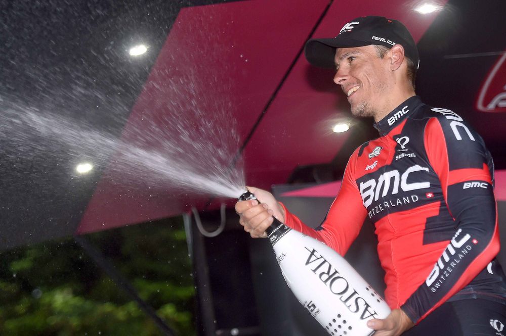Philippe Gilbert sprays some champagne on the stage 12 podium.