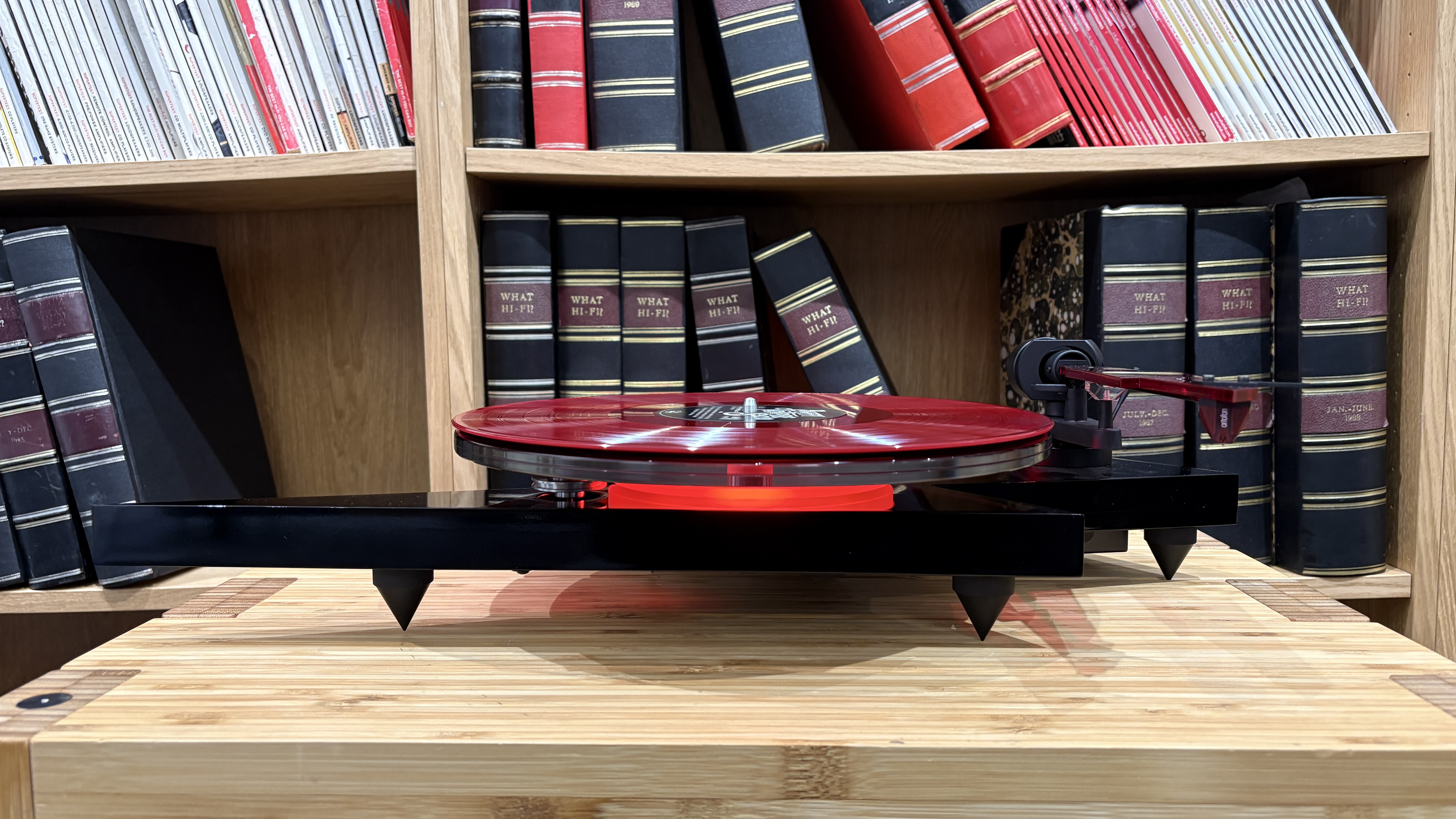 Pro-Ject AC/DC Turntable on wooden hi-fi rack
